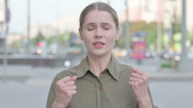 Angry Young Woman Screaming in Frustration Outdoor
