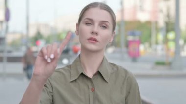 Rejecting Young Woman in Denial Standing Outdoor