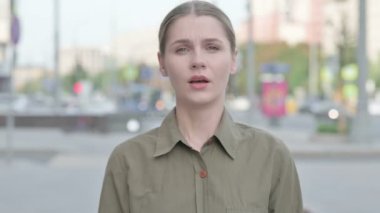 Rejecting Young Woman Shaking Head in Denial Outdoor