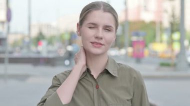 Tired Young Woman with Neck Pain Outdoor