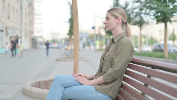 Young Woman Smiling Camera While Sitting Bench — Video