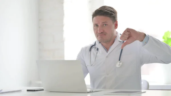 Middle Aged Doctor Showing Thumbs Sign While Using Laptop Office — Zdjęcie stockowe