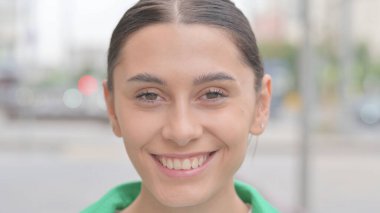 Close up of Smiling Young Woman Face Outdoor