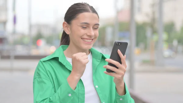 Young Woman Celebrating Online Success Smartphone Outdoor — Stock Fotó