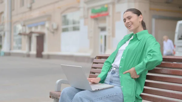 Young Woman Back Pain Using Laptop While Sitting Outdoor Bench — 图库照片