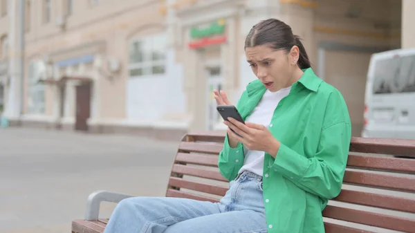 Young Woman Reacting Loss Smartphone While Sitting Outdoor Bench — Photo