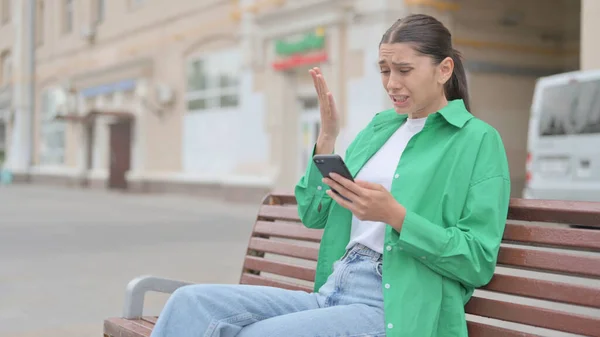 Young Woman Reacting Loss Smartphone While Sitting Outdoor Bench — Photo