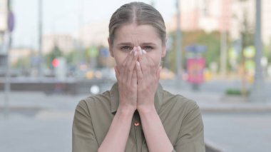 Portrait of Sad Young Woman Crying Outdoor