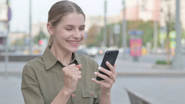 Young Woman Celebrating Success Smartphone Outdoor — Stock Photo, Image