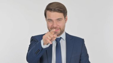 Young Adult Businessman Pointing at the Camera on White Background