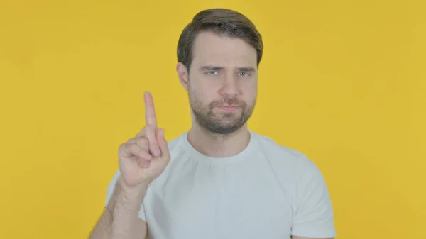 Rejecting Casual Young Man Arm Gesture Yellow Background — 图库照片