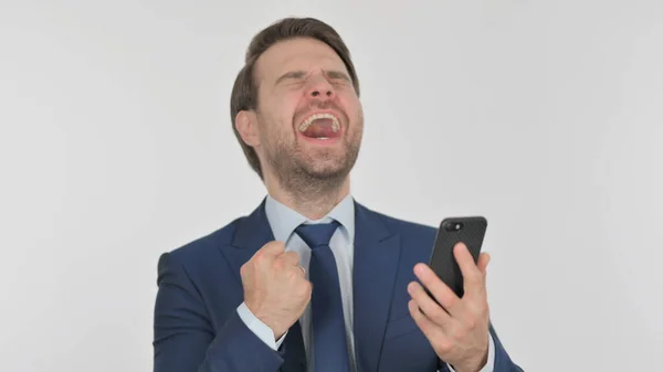 Young Adult Businessman Celebrating Smartphone White Background — Fotografie, imagine de stoc