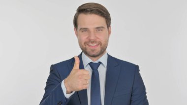 Thumbs Up by Young Adult Businessman on White Background