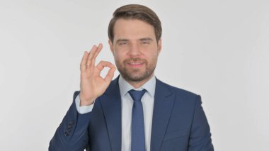 Casual Young Man with Victory Sign on Yellow Background