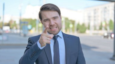 Portrait of Angry Middle Aged Businessman Fighting Outdoor