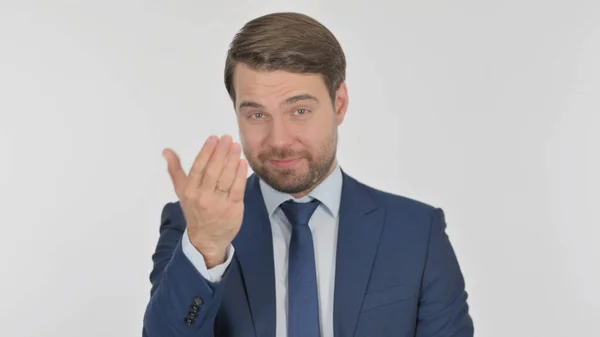 Young Adult Businessman Pointing Camera Inviting White Background — Zdjęcie stockowe