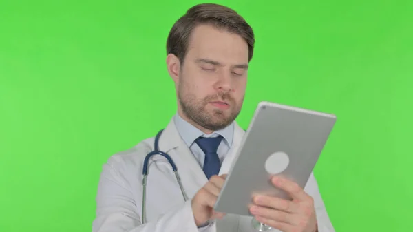 Young Adult Doctor Using Digital Tablet Green Background — Stok fotoğraf