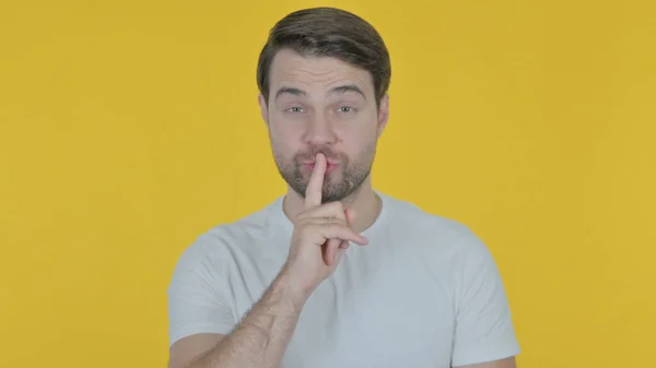 Casual Young Man Finger Lips Silence Yellow Screen — 스톡 사진