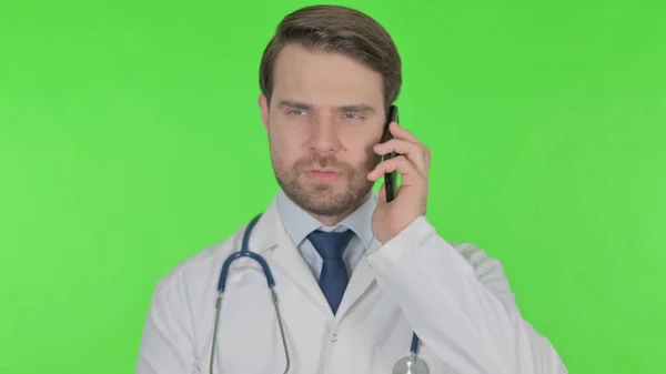 Young Adult Doctor Talking Phone Green Background — Photo