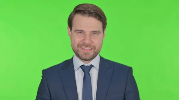 Smiling Young Adult Businessman Green Background — Φωτογραφία Αρχείου