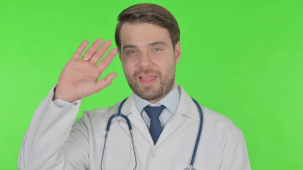 Young Adult Doctor Talking Online Video Call Green Background — Φωτογραφία Αρχείου