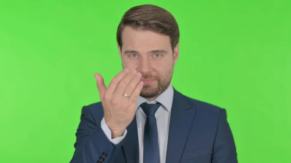 Young Adult Businessman Pointing Camera Inviting Green Background — Φωτογραφία Αρχείου