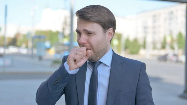 Businessman Coughing While Standing Outdoor — 图库照片