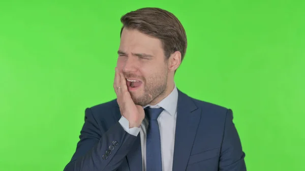 Young Adult Businessman Having Toothache Green Background — Φωτογραφία Αρχείου