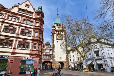 Freiburg, Germany - April 2022: Tower with gate called 'Martinstor', a remaining city gate of the medieval defensive wall