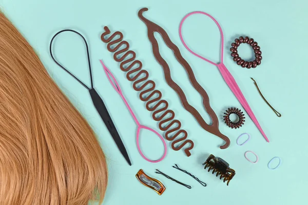 Hair styling tools like bun maker, braid tool, ponytail style maker, hair clip, rubber bands and pins