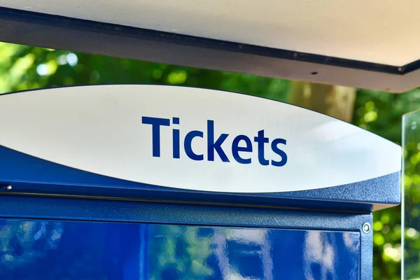 Word 'Ticket' at public transportation ticket machine
