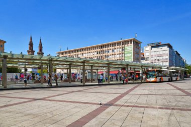Ludwigshafen, Germany - August 2022: Town square called 'Berliner Platz' with public transportation bus and tram station