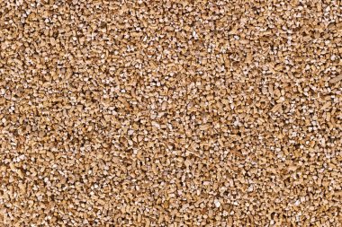 Exfoliated vermiculite, a hydrous mineral used as soilless growing medium for plants clipart