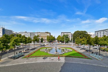 Mannheim, Germany - September 2022: Public park with fountain and flowers in city center of Mannheim called 'Friedrichsplatz'