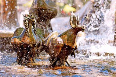 Neustadt an der Weinstrasse, Germany - August 2022: Sculpture at 'Elwedritsche Brunnen' fountain. Elwedritsche are a mythical creature mix of chickens, ducks, geese, goblins and elves from Palatinate 