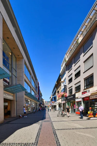 Kaiserslautern, Germany - August 2022: Shopping street called 'Fackelstrasse' with people in city center