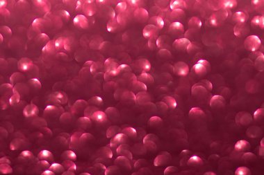 Pink defocused lights with glitter background. Christmas, New Year, Birthday, Valentine's Day. Copy space