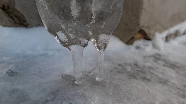 Original winter icicle on the wall of the house — Stock Photo, Image