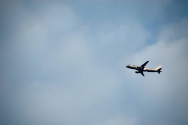 Background of sky with an airplane in one of the sides