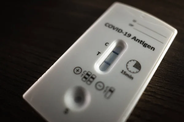 close up of a positive antigen test on Covid. self Inmunology and antibody test, positive in coronavirus. Home medical positive result. Self Inmunology and antibody test.