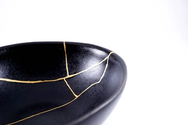 Isolated Black Japanese Kintsugi Bowl Antique Pottery Restored Gold Cracks — Photo