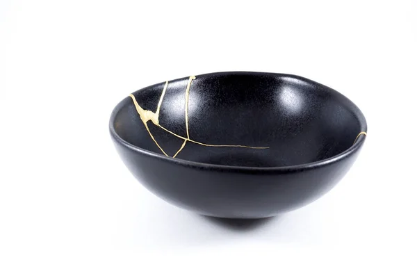 Isolated Black Japanese Kintsugi Bowl Antique Pottery Restored Gold Cracks — стоковое фото