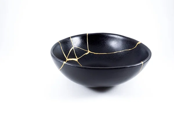 Isolated Black Japanese Kintsugi Bowl Antique Pottery Restored Gold Cracks — стоковое фото