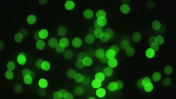 Yeşil bulanık noel ışıkları. Şenlik dağıtılmış arkaplan — Stok video