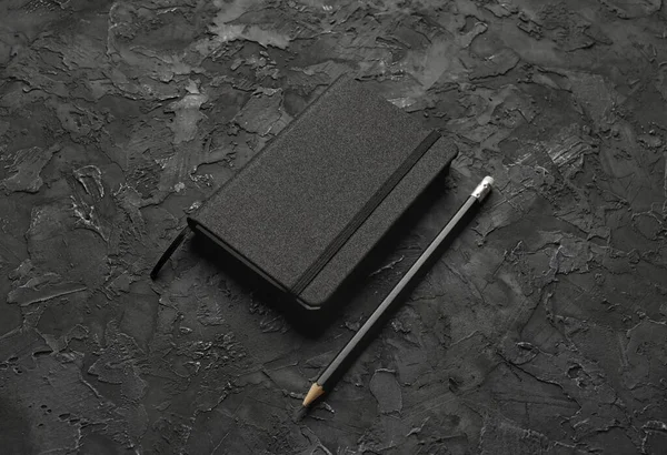 Blank Black Notebook Pencil Black Stone Background — Stock Photo, Image