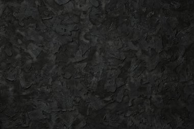 Siyah sıva dokusu. Siyah taş arka plan. Uzayı metin için kopyala. Düz yatıyordu.