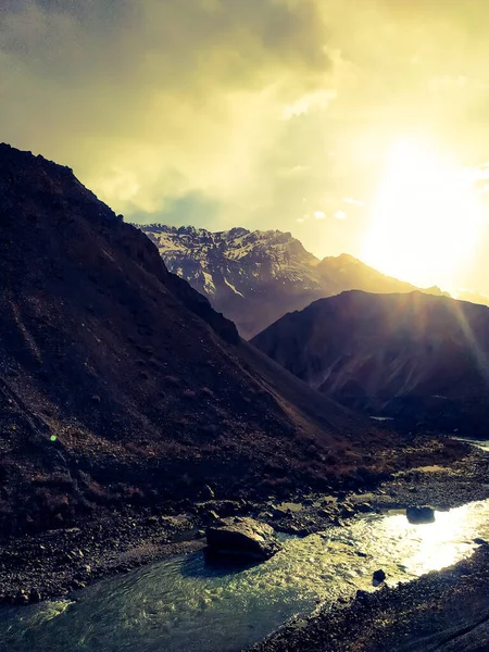 Amazing sunrise in the mountains with flowing river