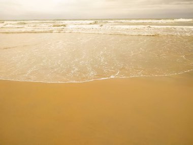 Beautiful sand beach with waves