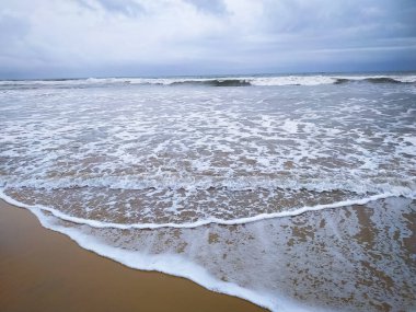White wave of the sea on the sand beach at India.