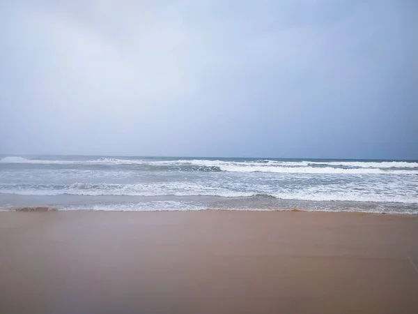 Soft waves of white sea on the Goa beach for the background.